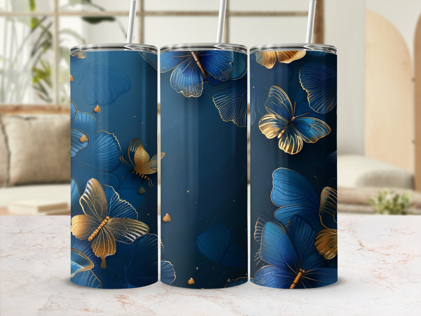 Blue and gold butterfly tumbler with straw.