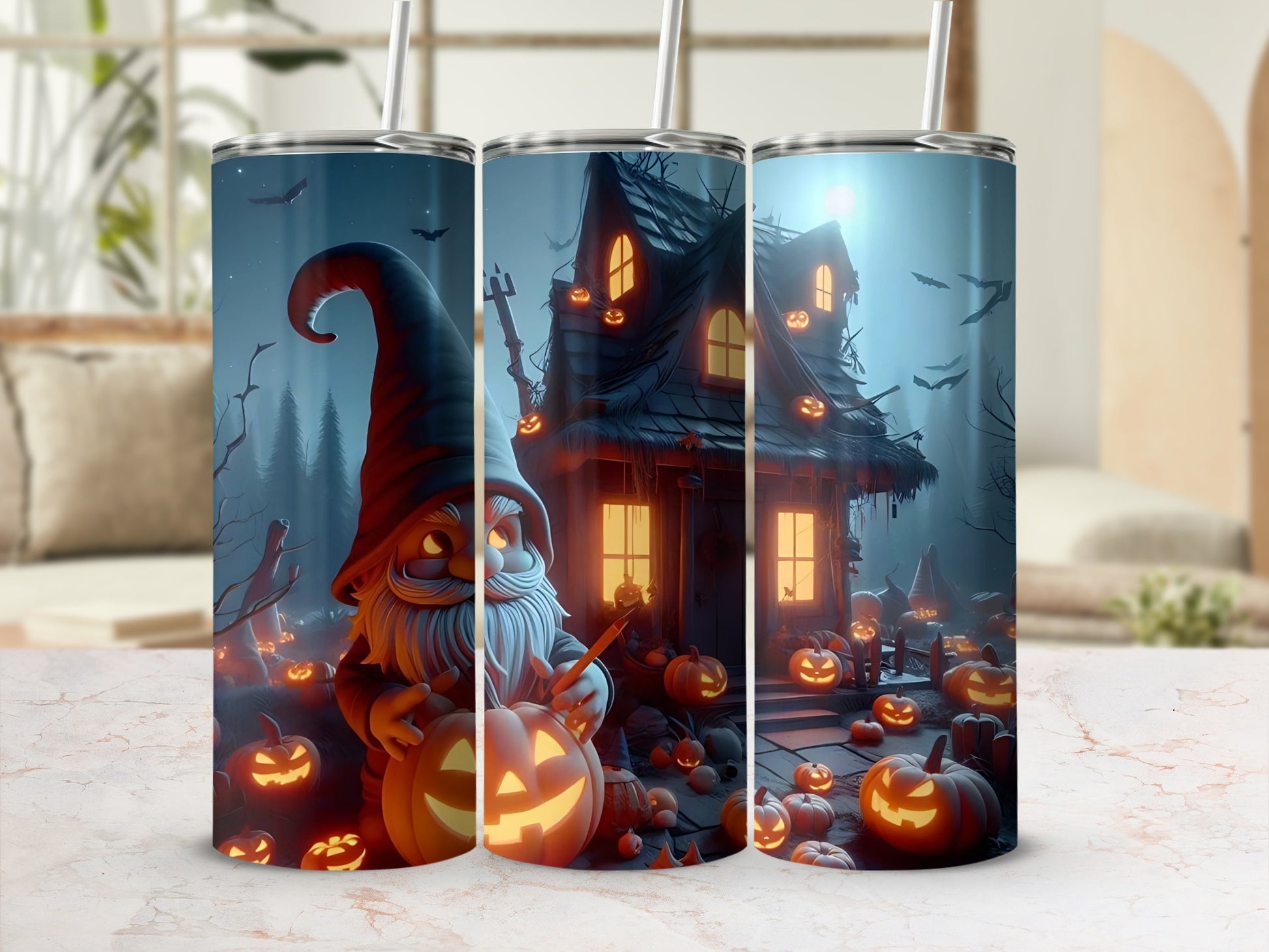 Gnome, haunted house, and pumpkins design on three tumblers with straws.