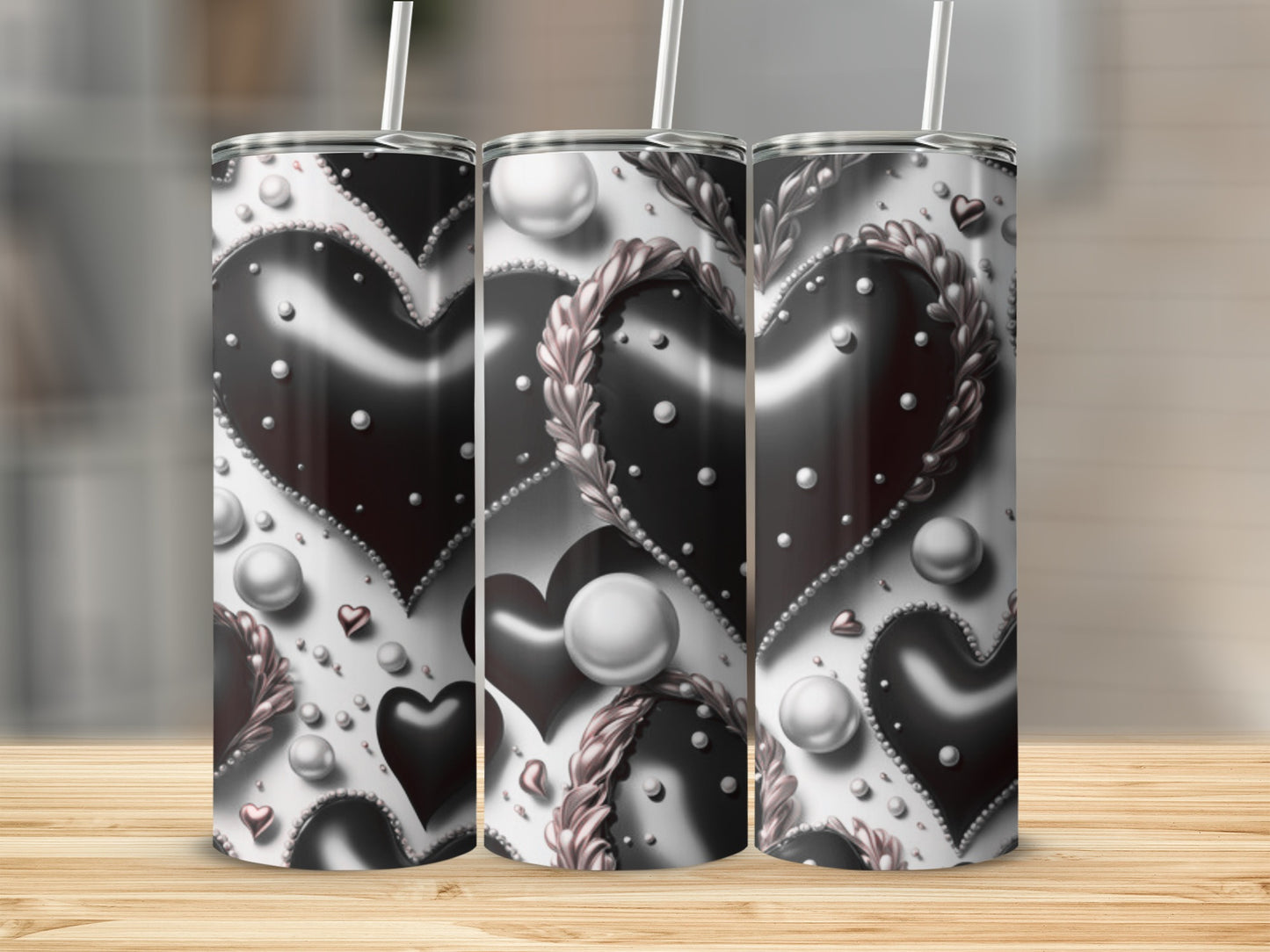 Three tumblers with a black and white heart and pearl pattern.