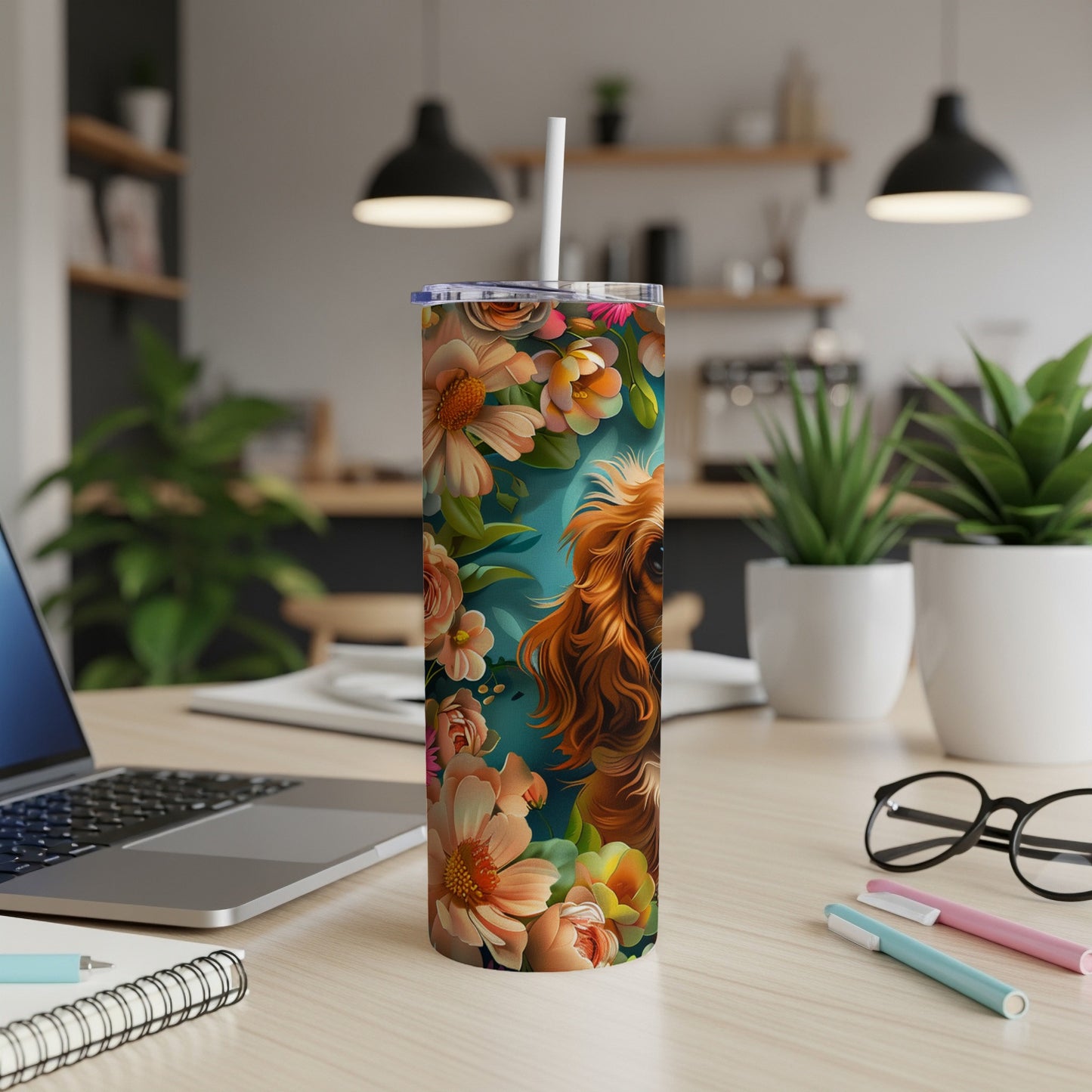 Cocker spaniel surrounded by colorful flowers on a skinny tumbler.