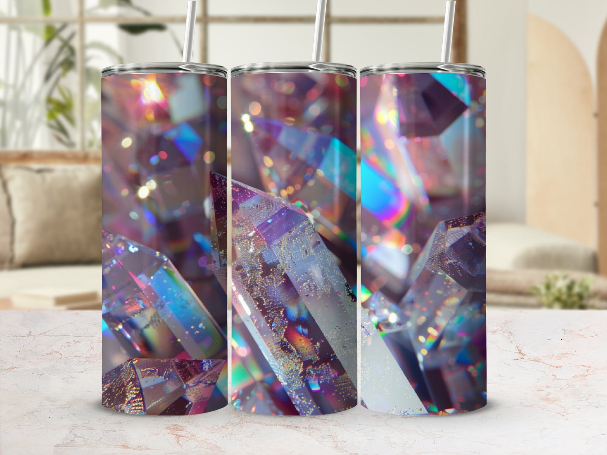 Three tumblers with iridescent crystal design and straws.