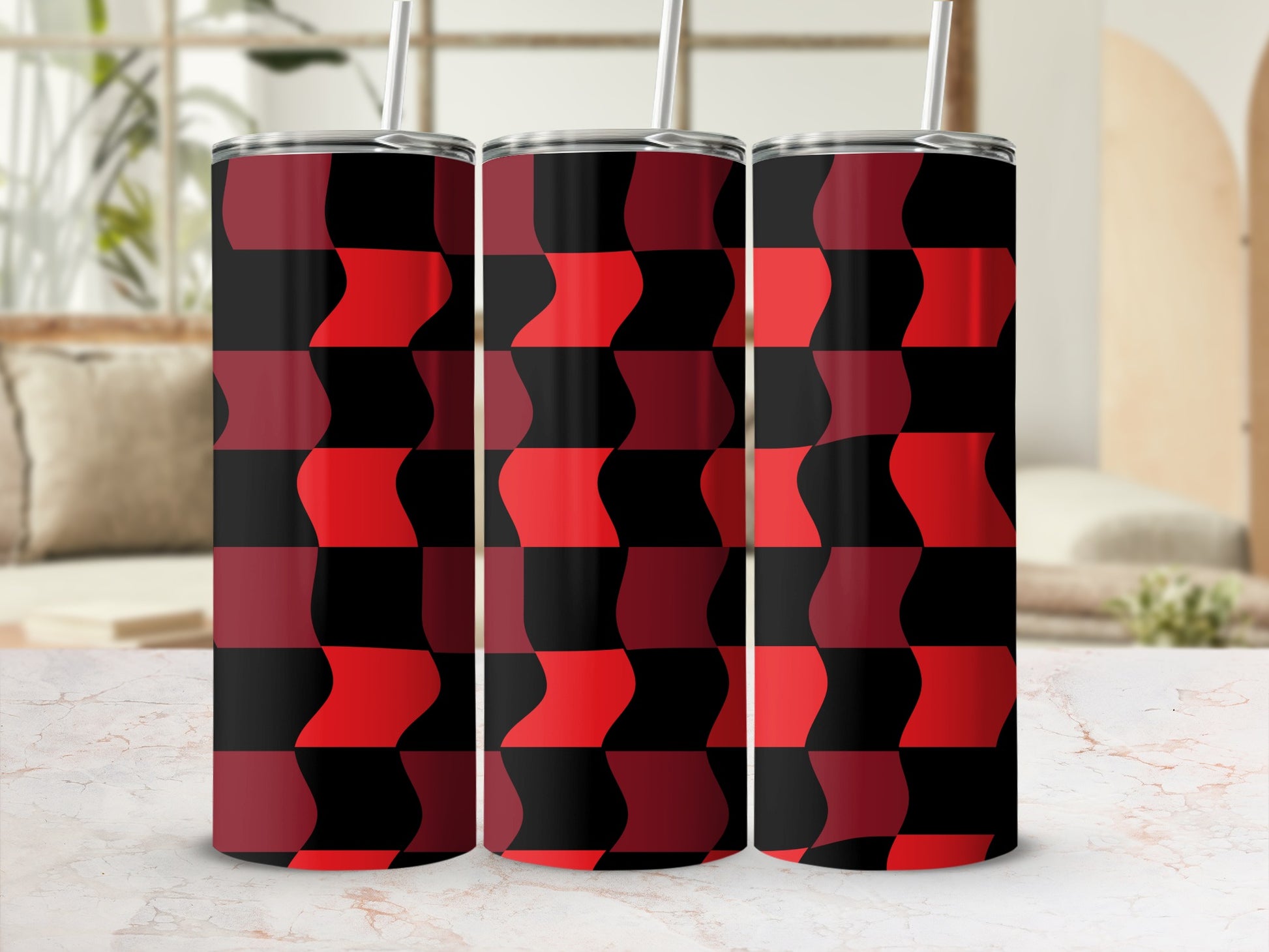 Three tall tumblers with a repeating red and black geometric pattern.
