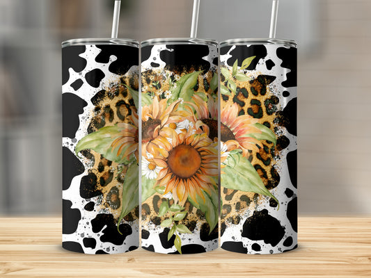 Three tumblers with cow print, leopard print, and sunflowers.