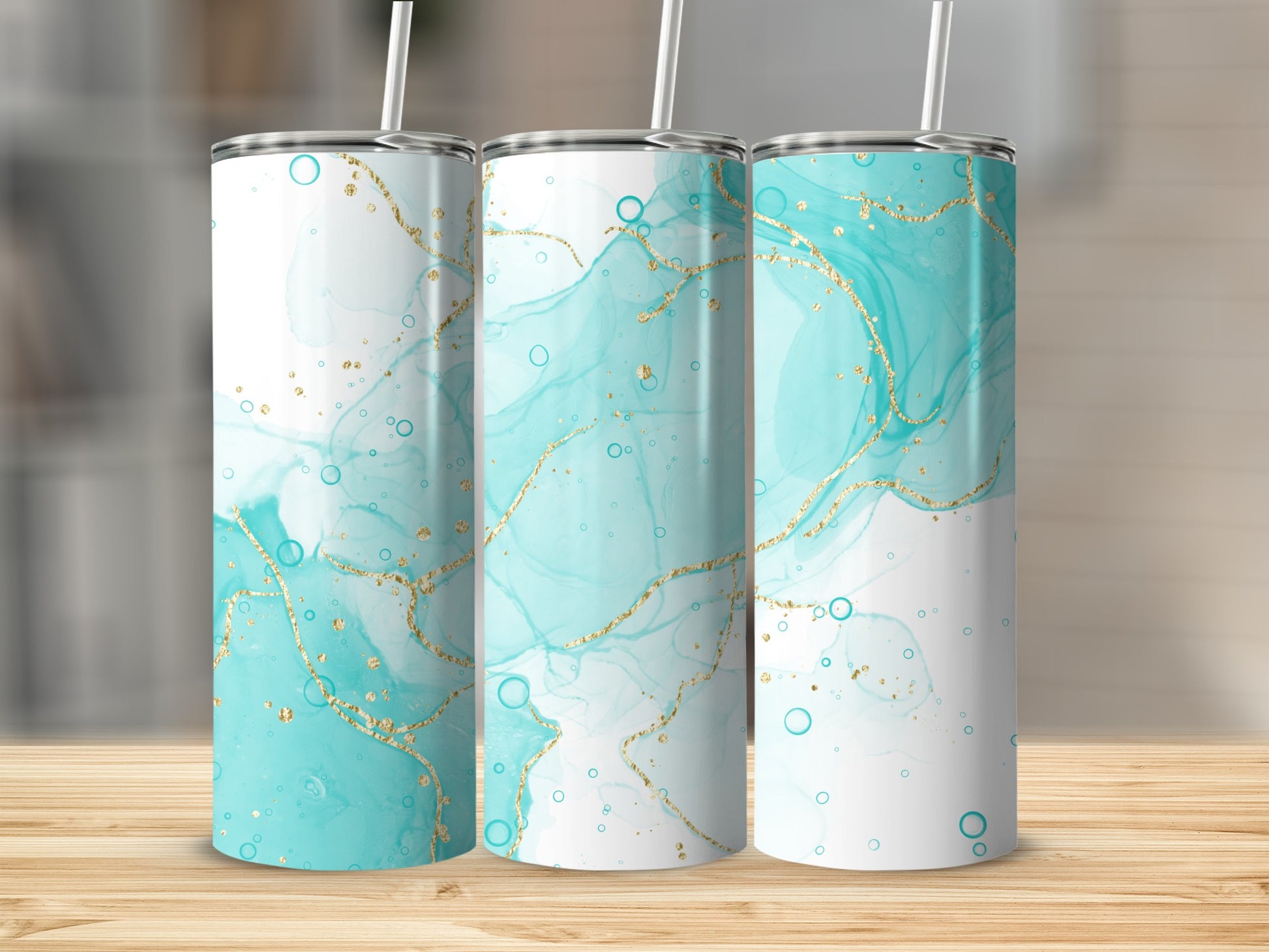 Three tumblers with a teal and gold abstract watercolor design.