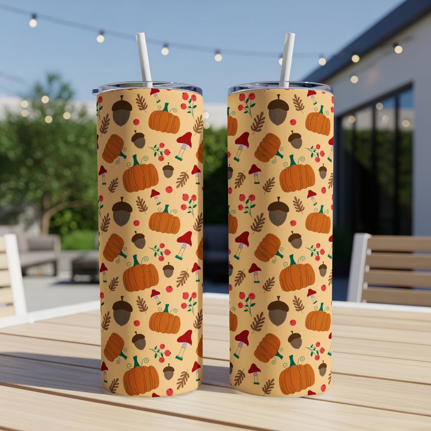 Two tumblers with a fall pattern of pumpkins, acorns, and mushrooms.