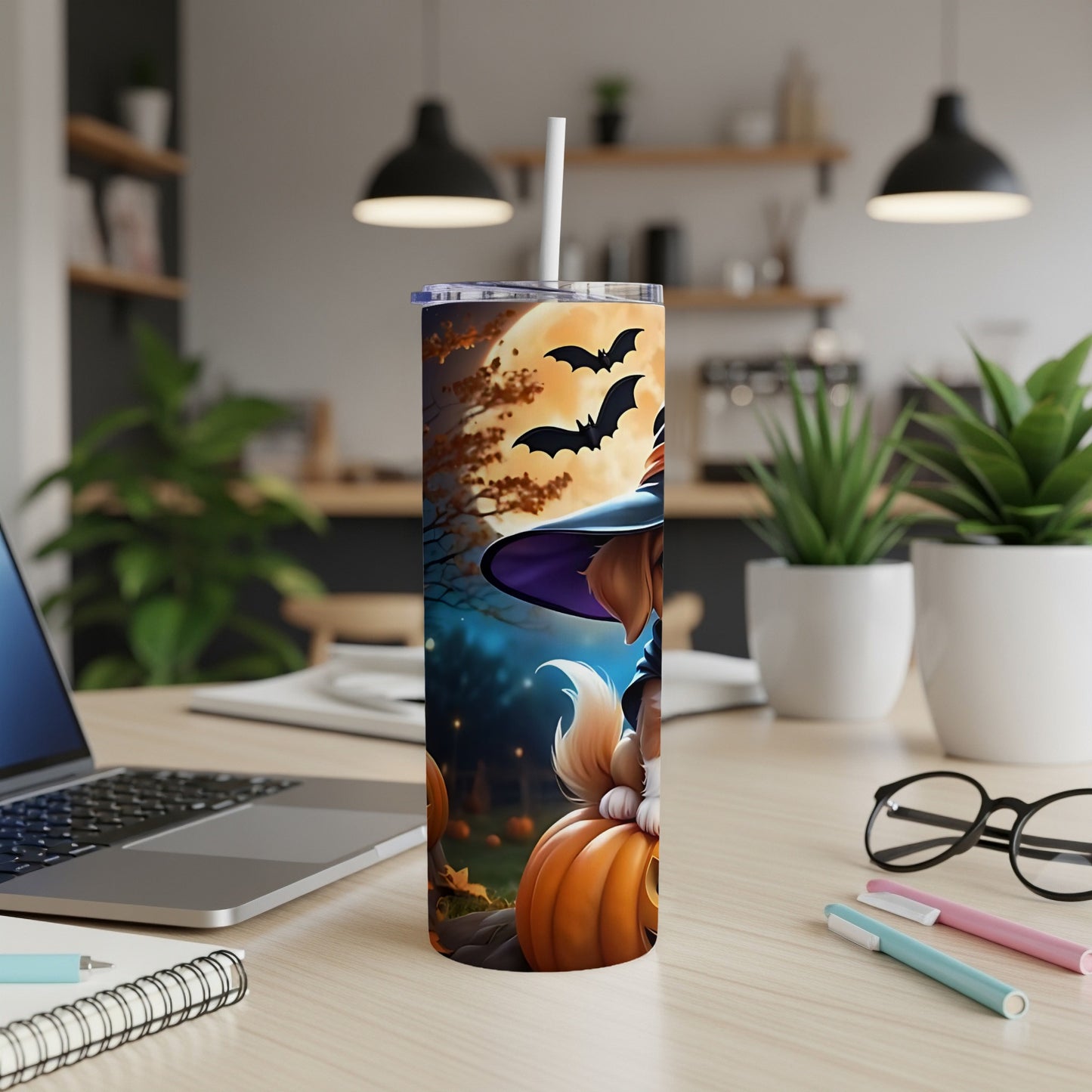 Halloween tumbler with a dog in a witch hat and bats on a pumpkin.