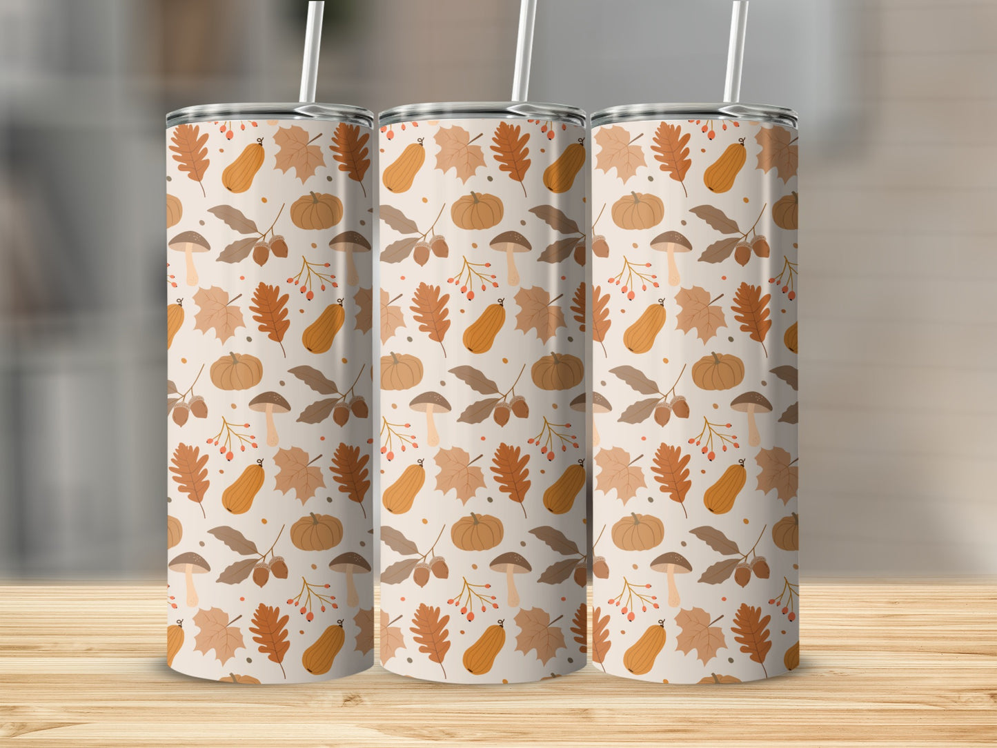 Three tumblers with a fall leaf and pumpkin pattern.