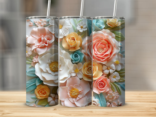 Three floral tumblers with assorted pastel flowers and leaves on a wooden surface.