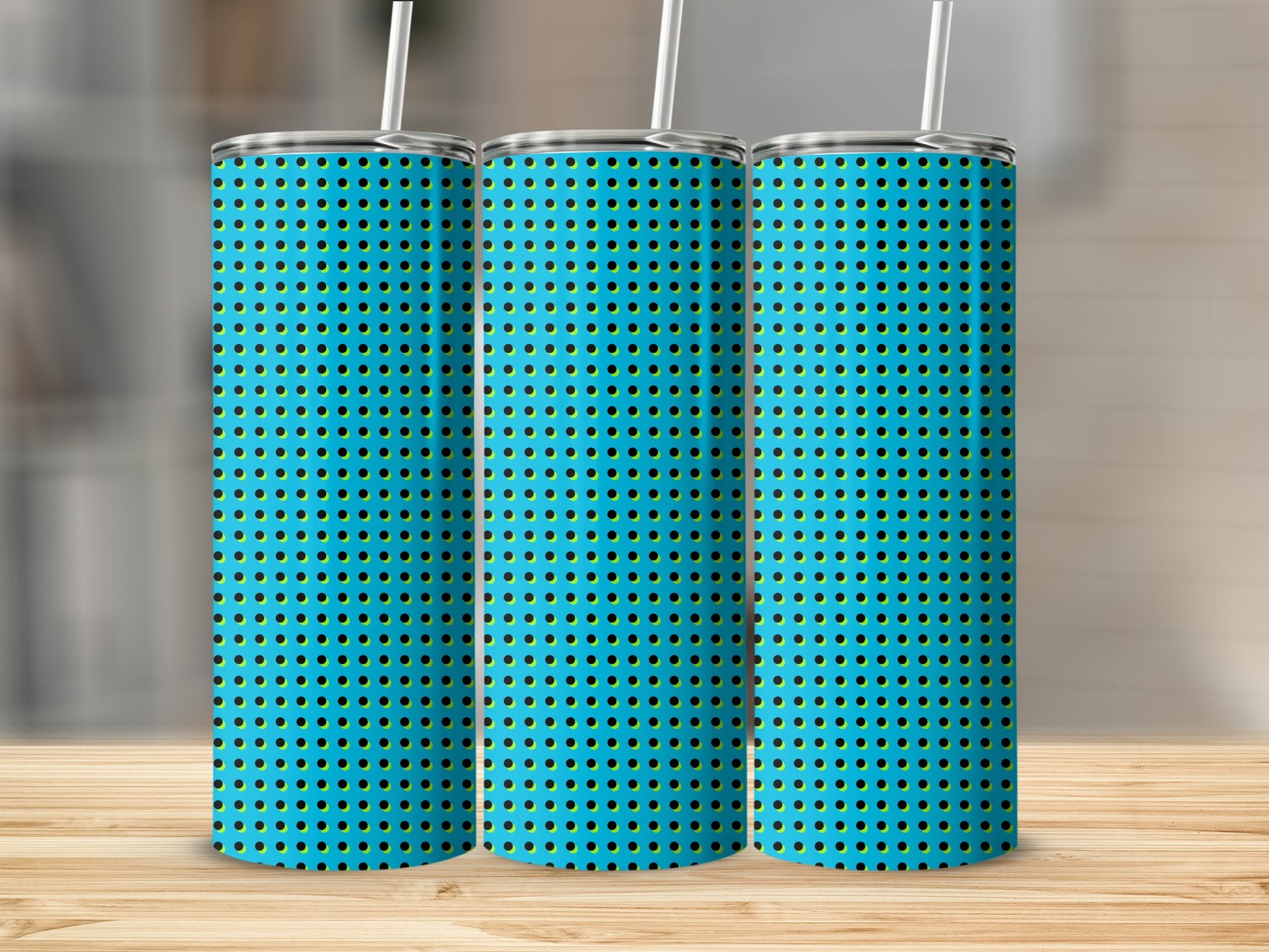 Three tumblers with blue background and black and yellow polka dot pattern.