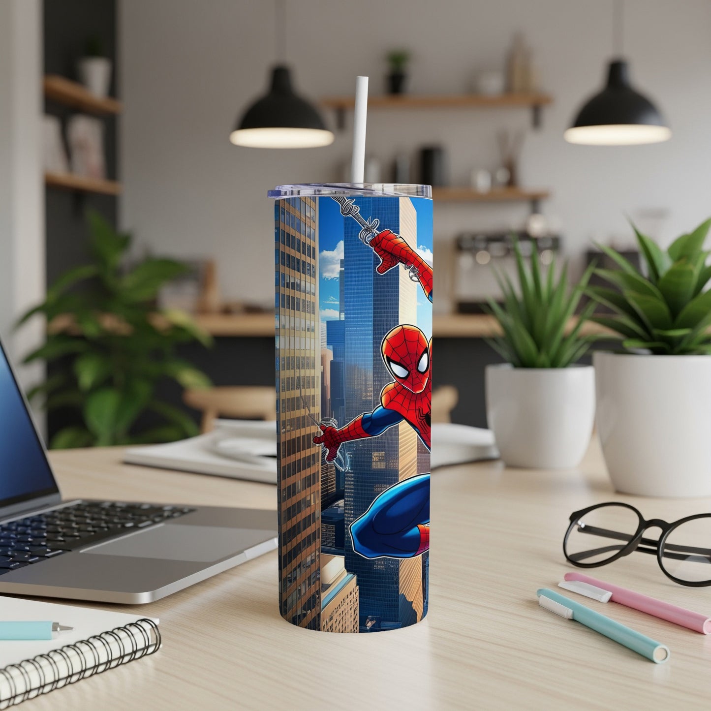 Spiderman tumbler with skyscraper background and a straw.