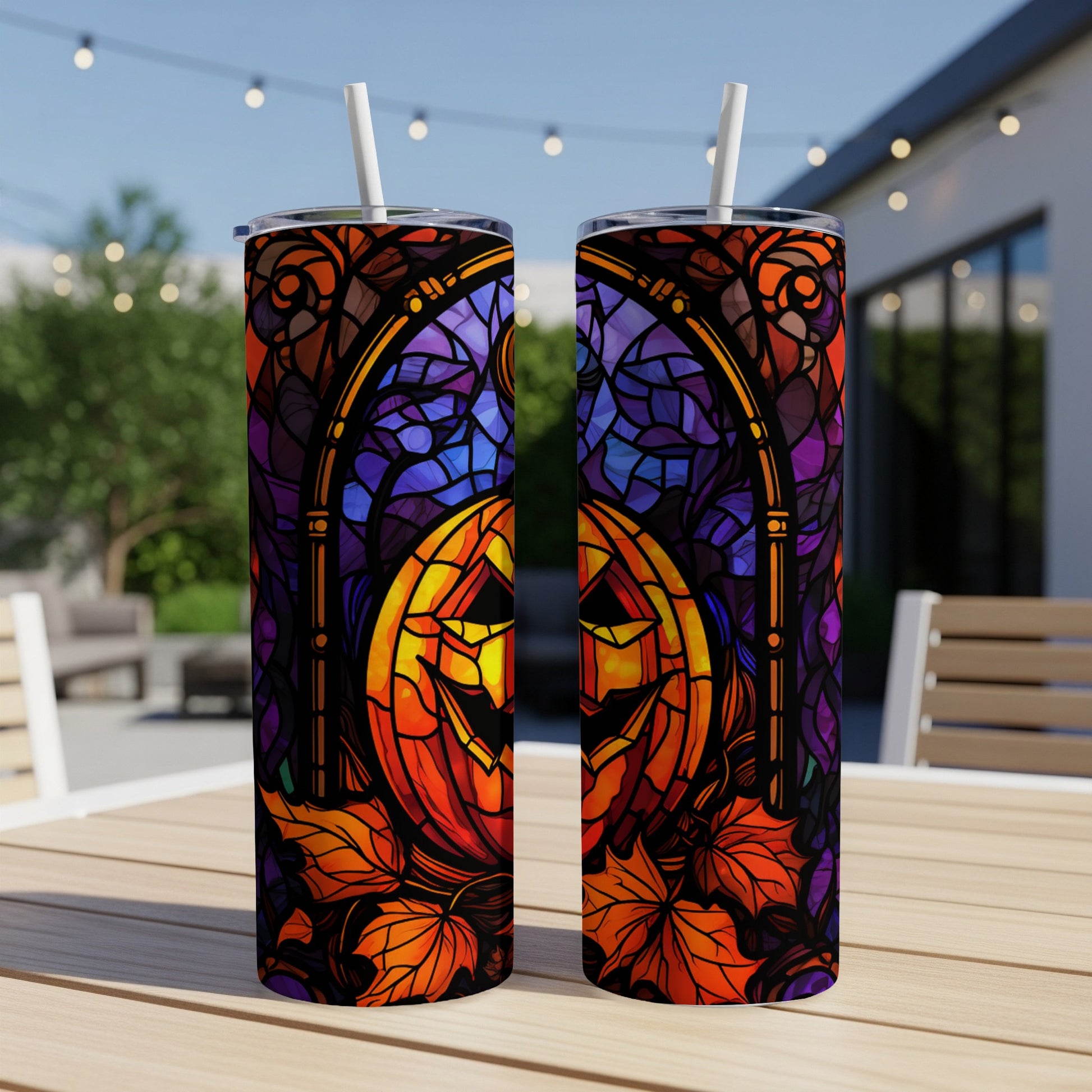 Halloween jack-o'-lantern and autumn leaves stained glass design on two tumblers.