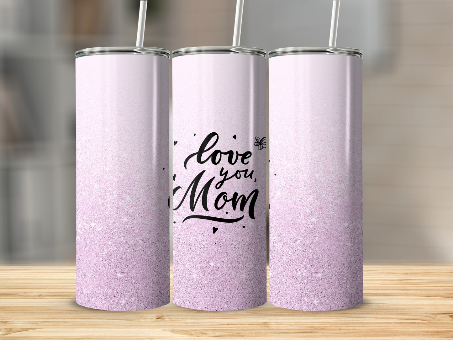 Three tumblers with "love you, Mom" text and a light purple glitter gradient.