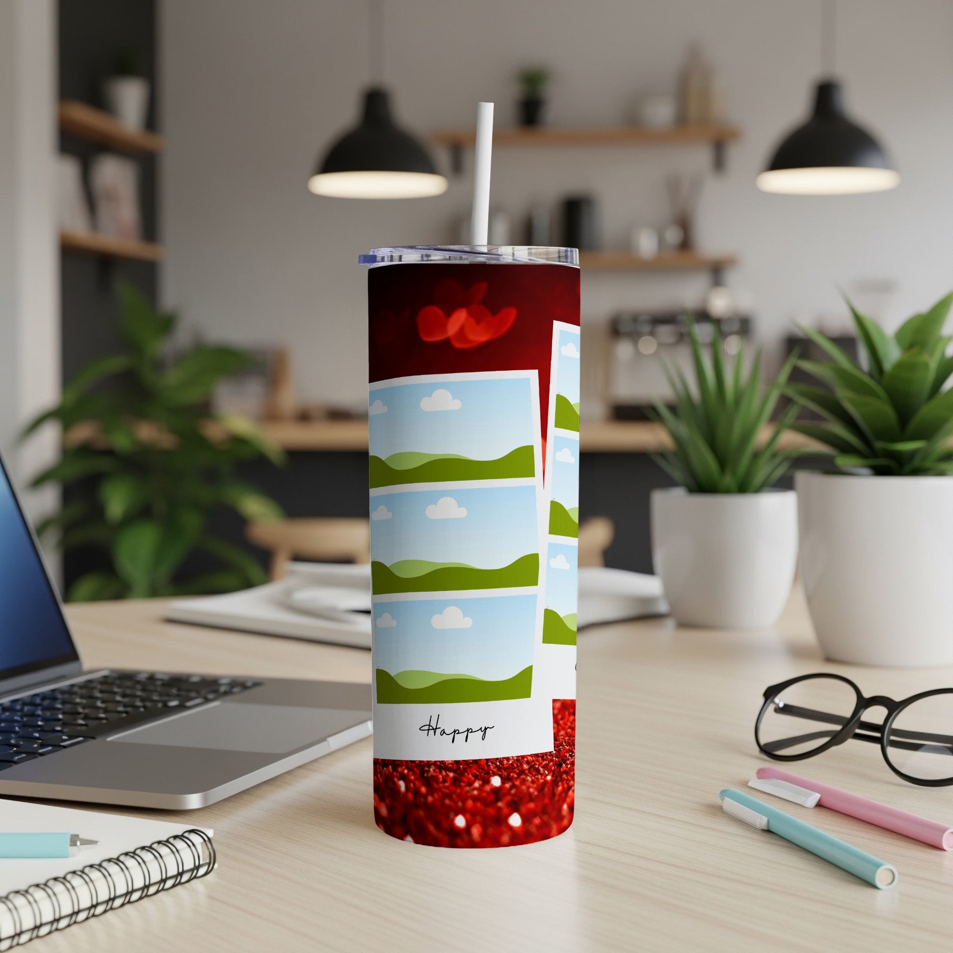 Red tumbler with photo collage and "Happy" text on a desk.