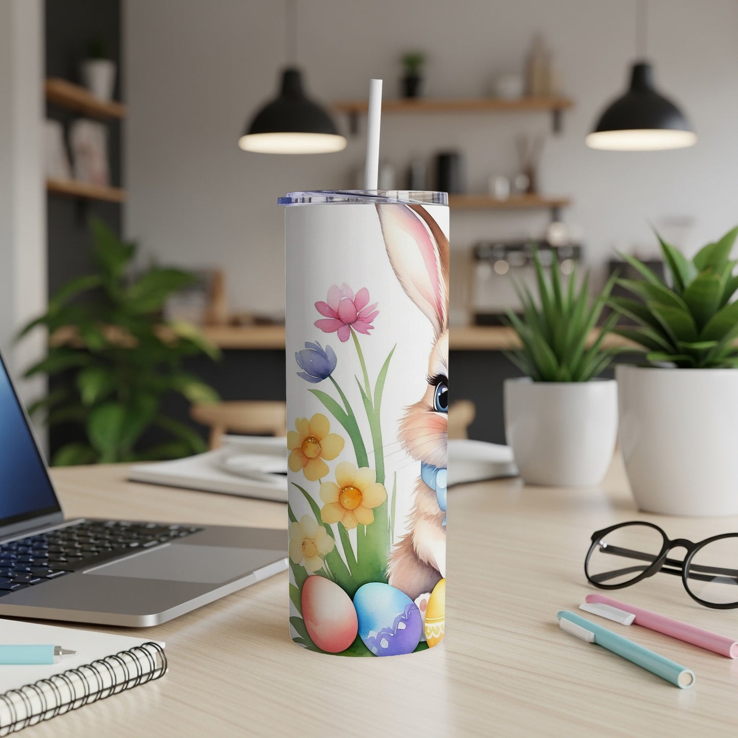 Easter bunny tumbler with colorful eggs and flowers.