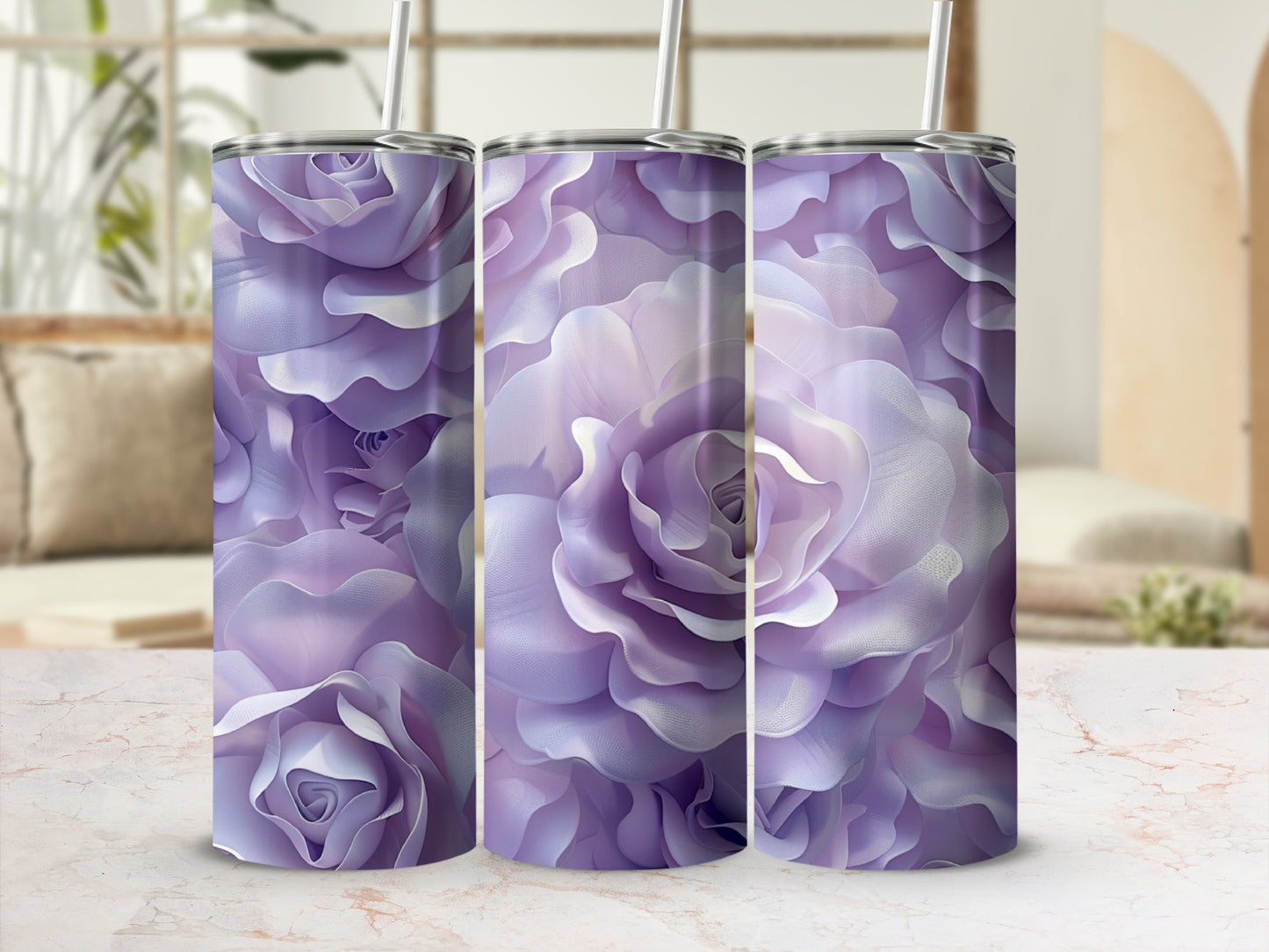 Three purple rose-patterned tumblers with straws.