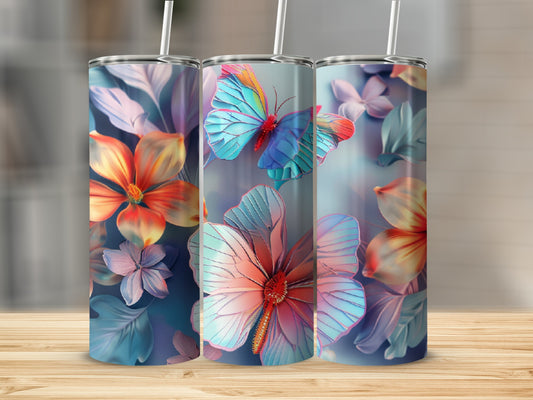 Three tumblers with colorful butterfly and floral designs on a wooden surface.