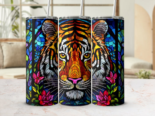 Stained glass tiger face with floral accents on a tumbler.