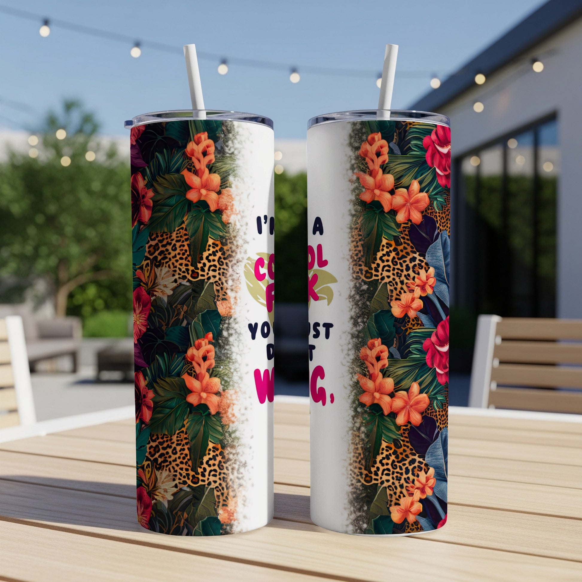 Two tumblers with floral and leopard print designs and text "I'm cool, you're not".