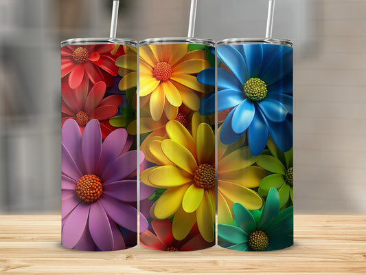 Three tumblers with colorful daisy floral designs.