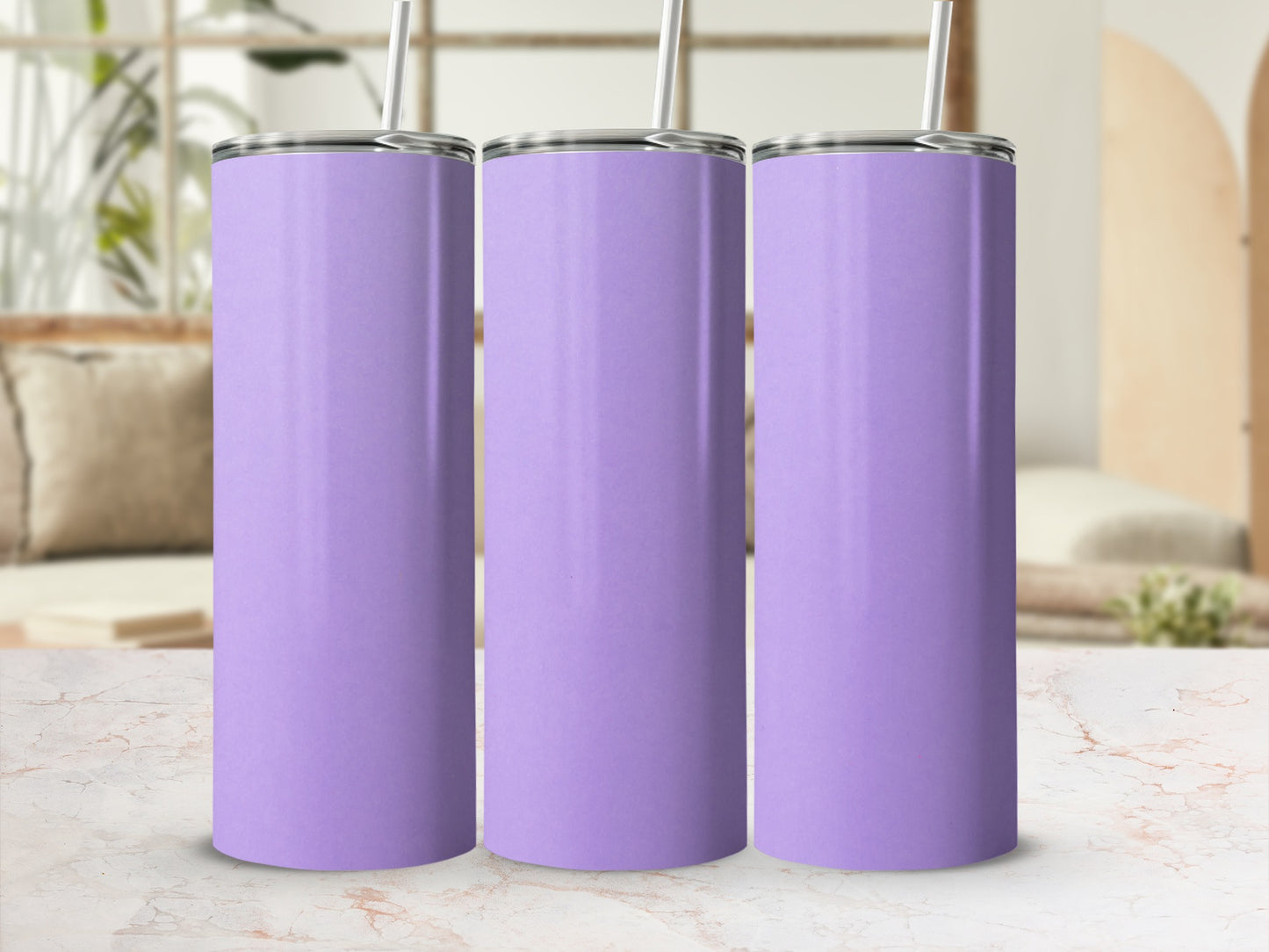 Three plain purple tumblers with straws stand in a row.