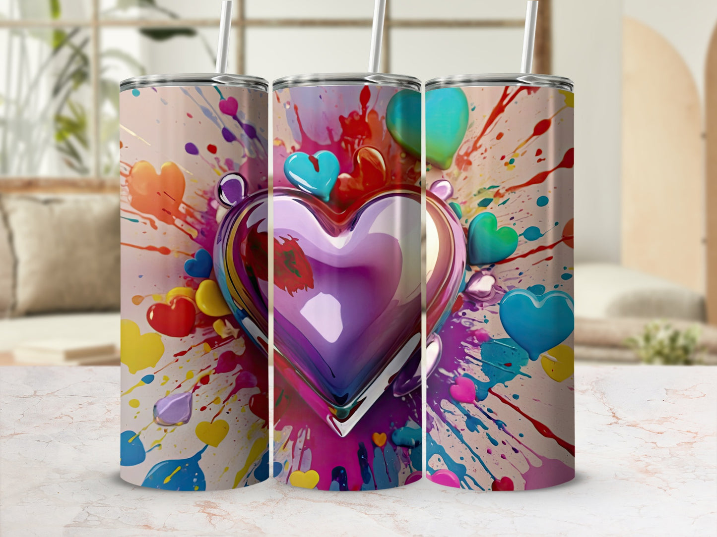 Tumbler with colorful paint splatters and a large metallic heart.