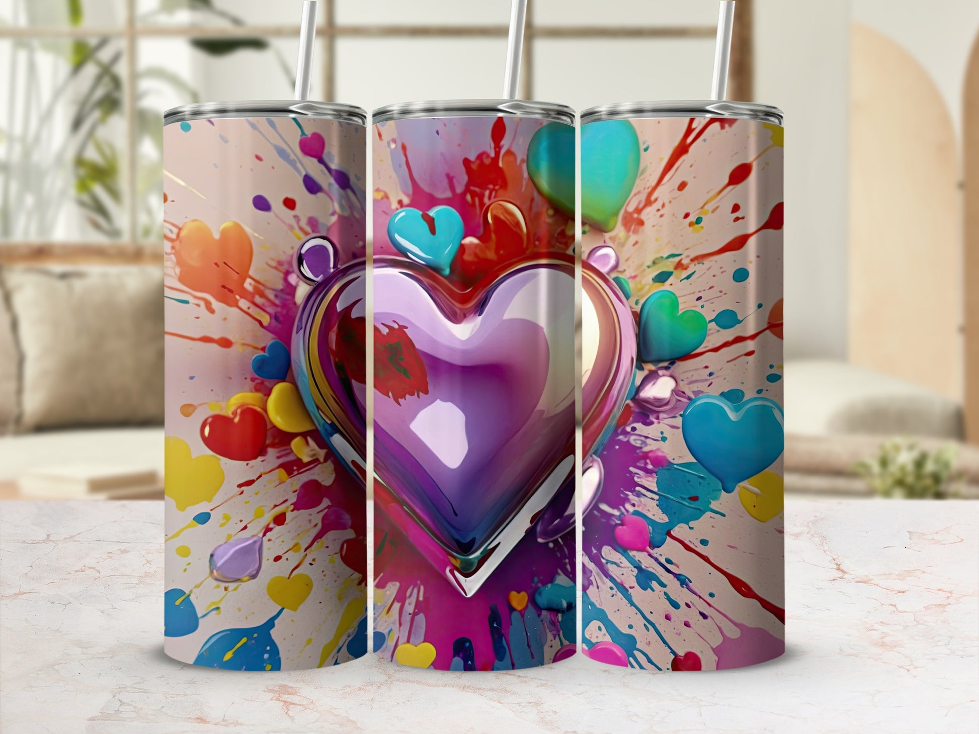 Tumbler with colorful paint splatters and a large metallic heart.