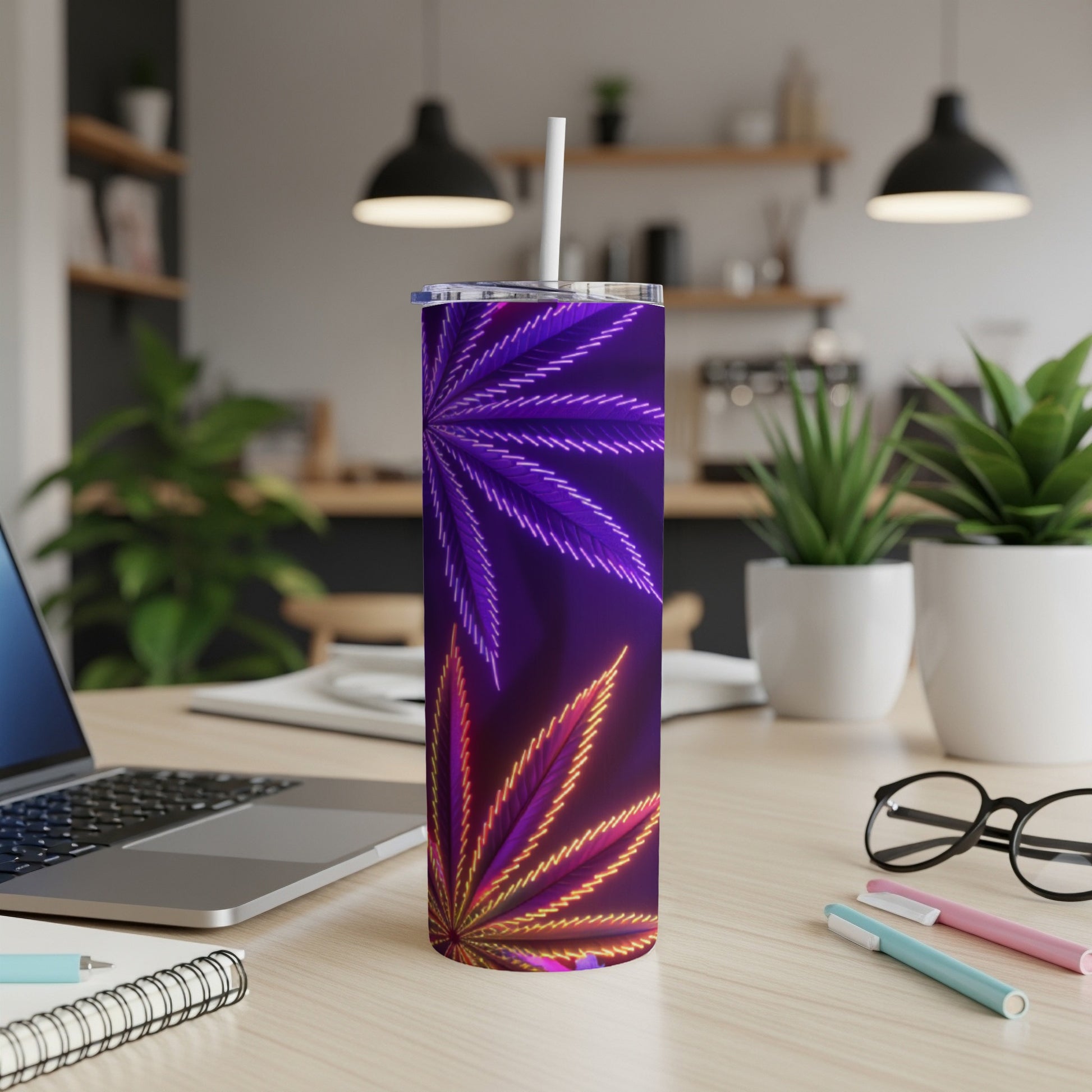 Purple and orange cannabis leaf pattern on a stainless steel tumbler with straw.