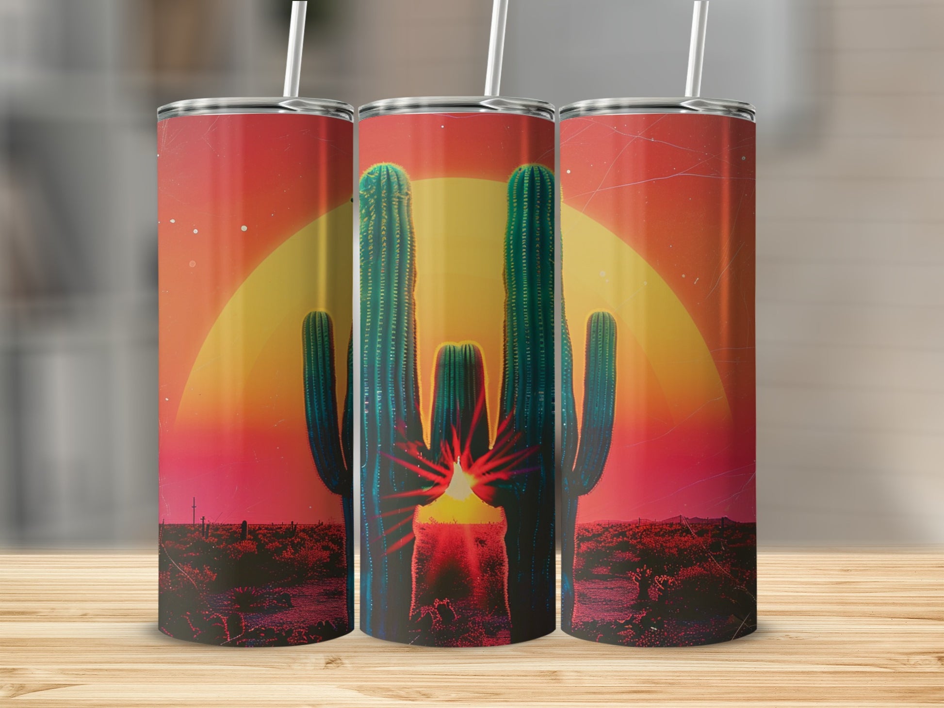 Three tumblers with a desert sunset and saguaro cactus design.