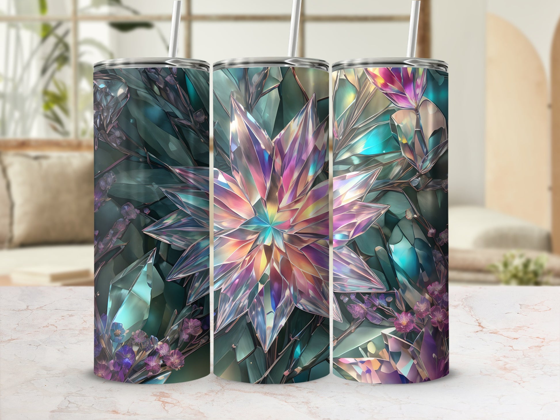 Three iridescent crystal tumblers with floral accents and straws.