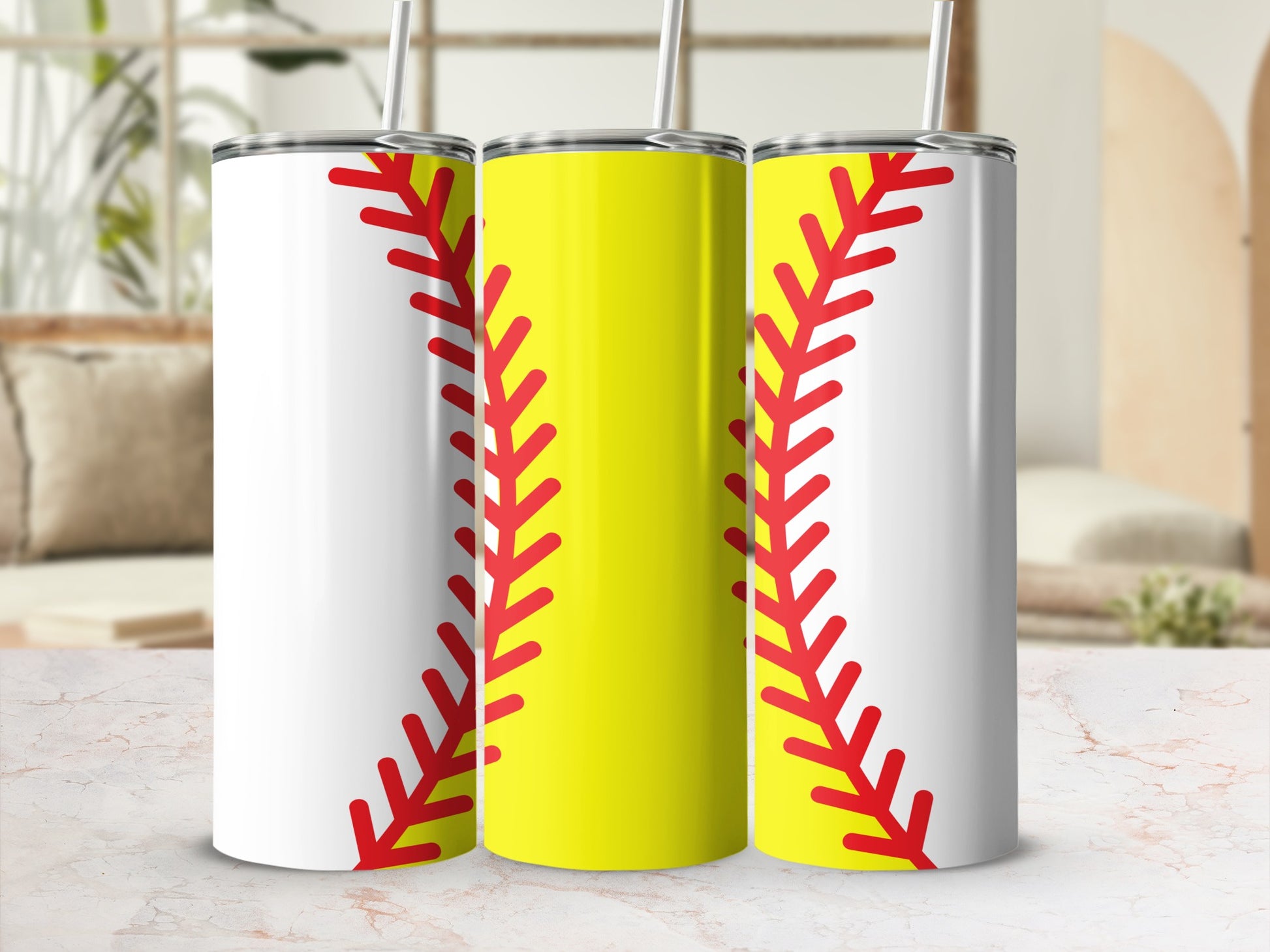 Three stainless steel tumblers with softball stitch design.