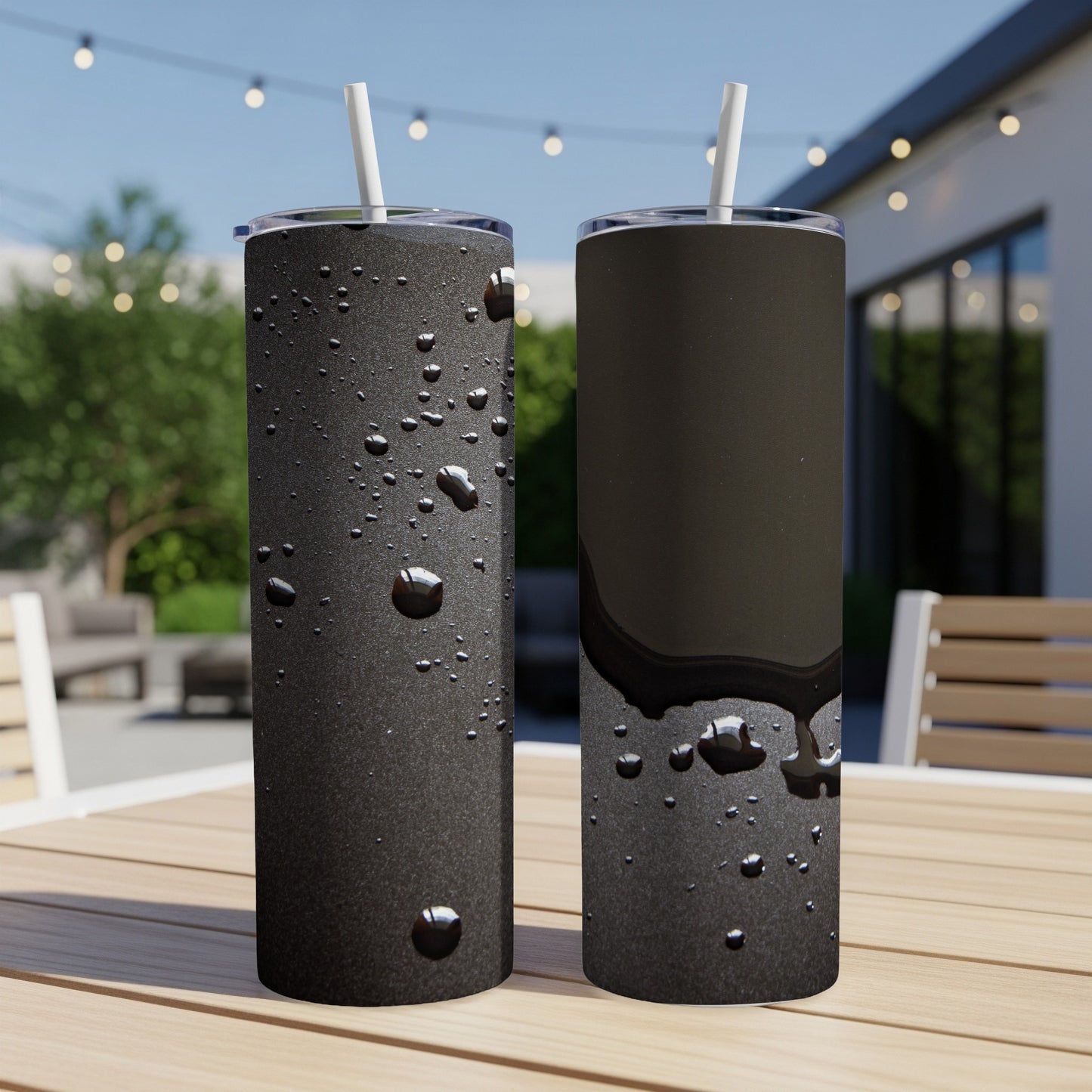 Two black tumblers with condensation, one showing a dark liquid.