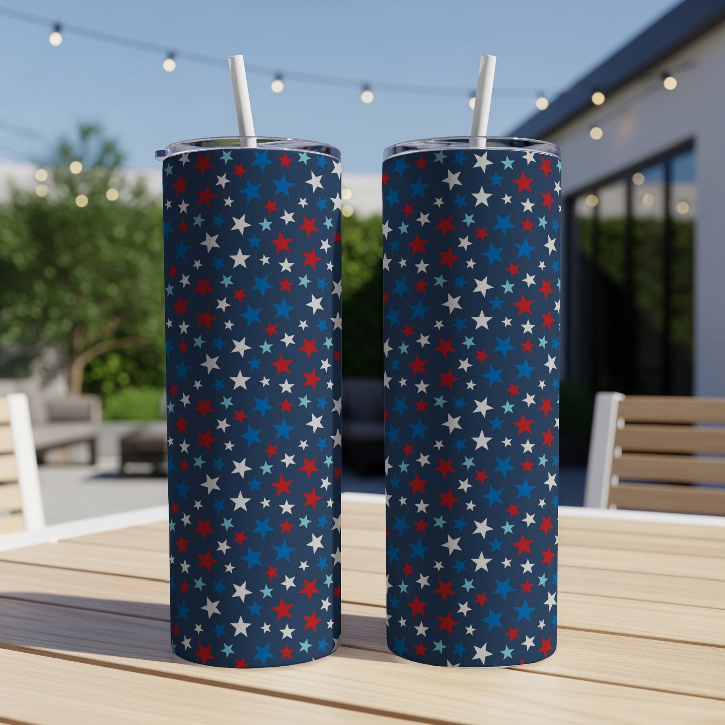 Two navy blue tumblers with red, white, and blue star patterns.