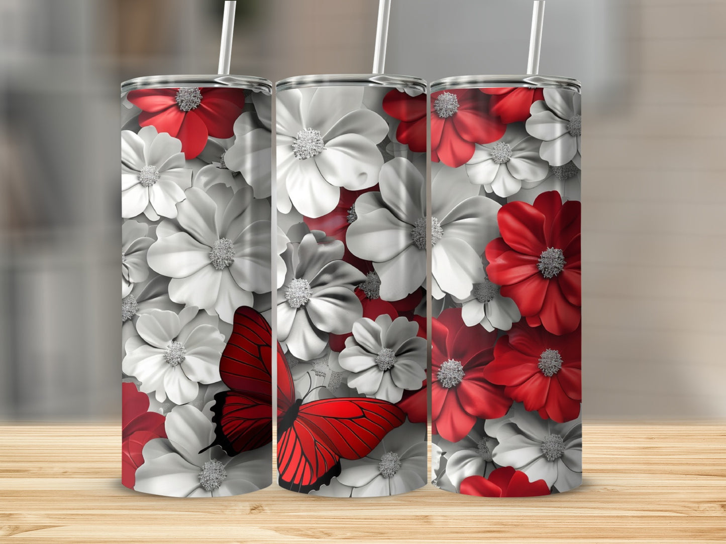 Tumbler with red butterfly and white and red flowers.