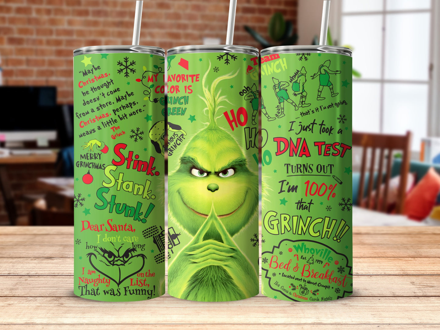 Grinchy green tumbler with Christmas phrases and illustrations.