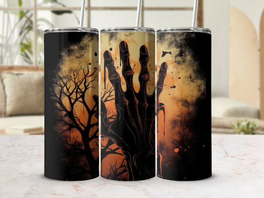 Three tumblers with Halloween themed designs featuring a spooky hand and bare trees.