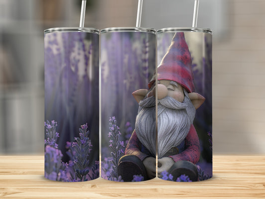 Gnome with red hat and beard sitting among lavender flowers.