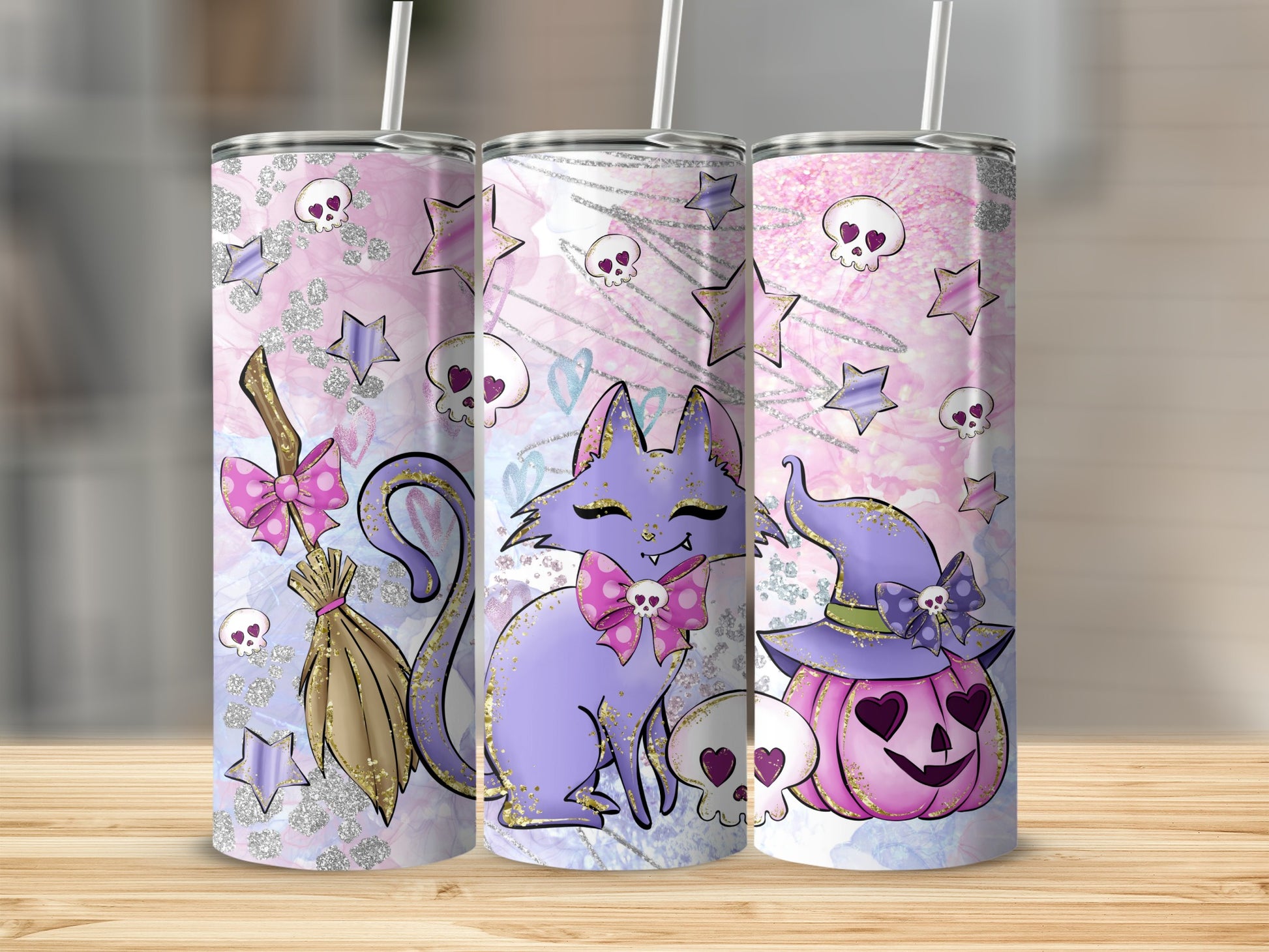 Three purple and pink Halloween tumblers with cats, pumpkins, and skulls.