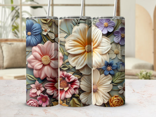Three tumblers with floral designs: pink, blue, and yellow flowers.