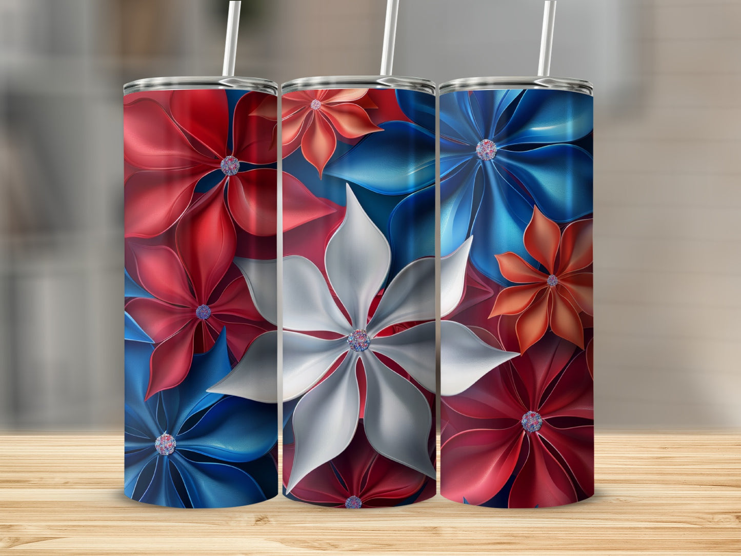 Three tumblers with red, white, and blue floral designs.