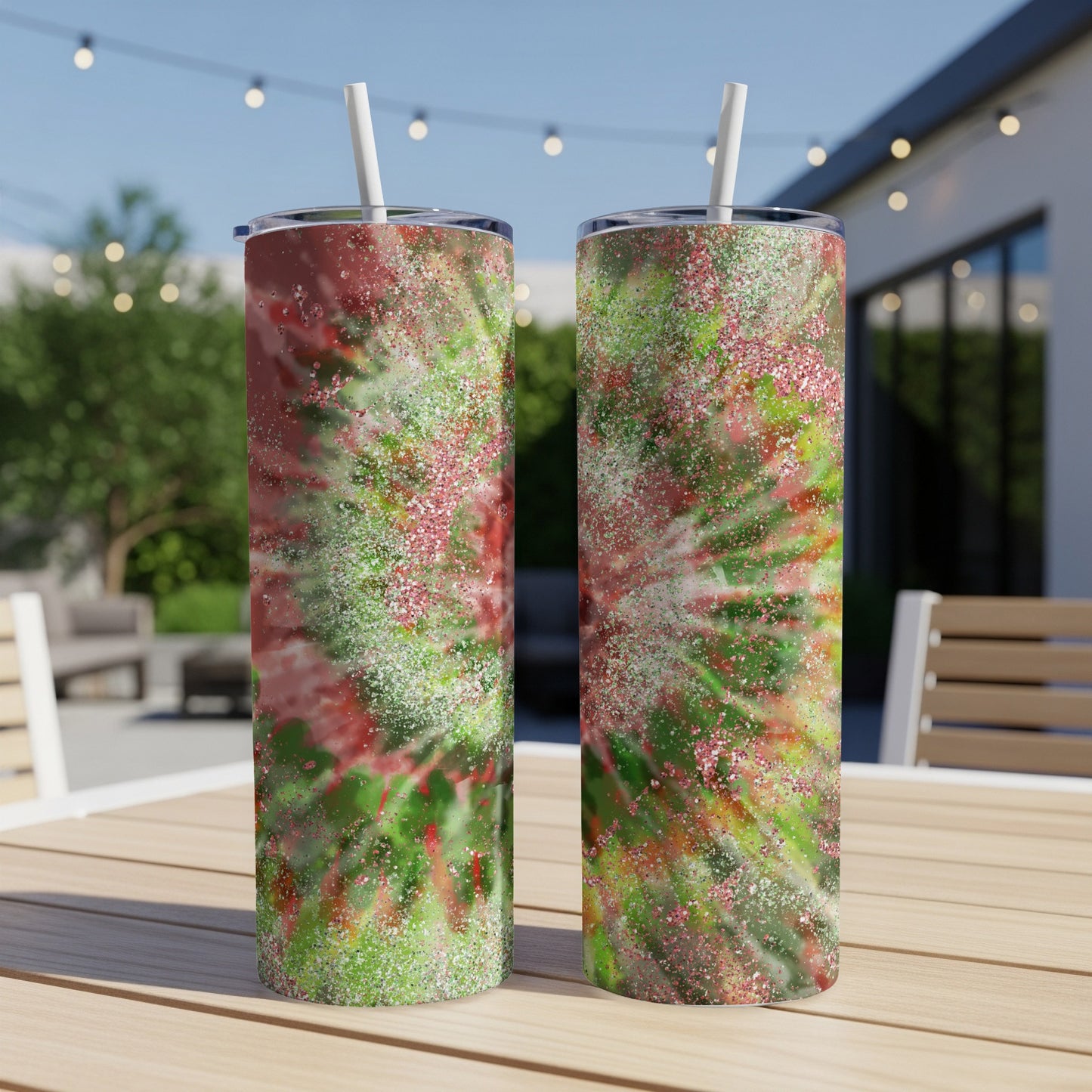 Two tumblers with a red and green tie-dye design and glitter accents.