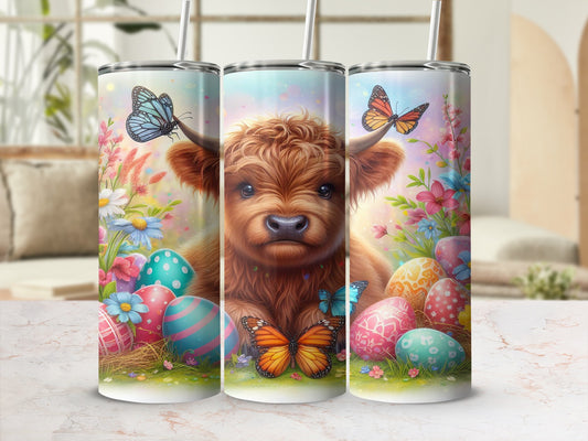 Highland cow with Easter eggs and butterflies design on a tumbler.