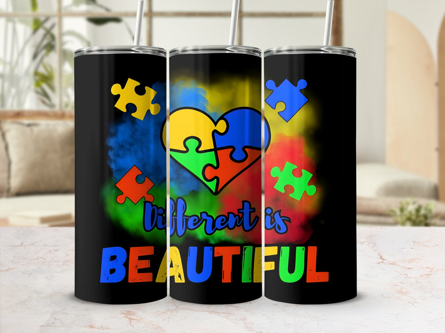 Black tumbler with colorful autism puzzle heart and "Different is BEAUTIFUL" text.