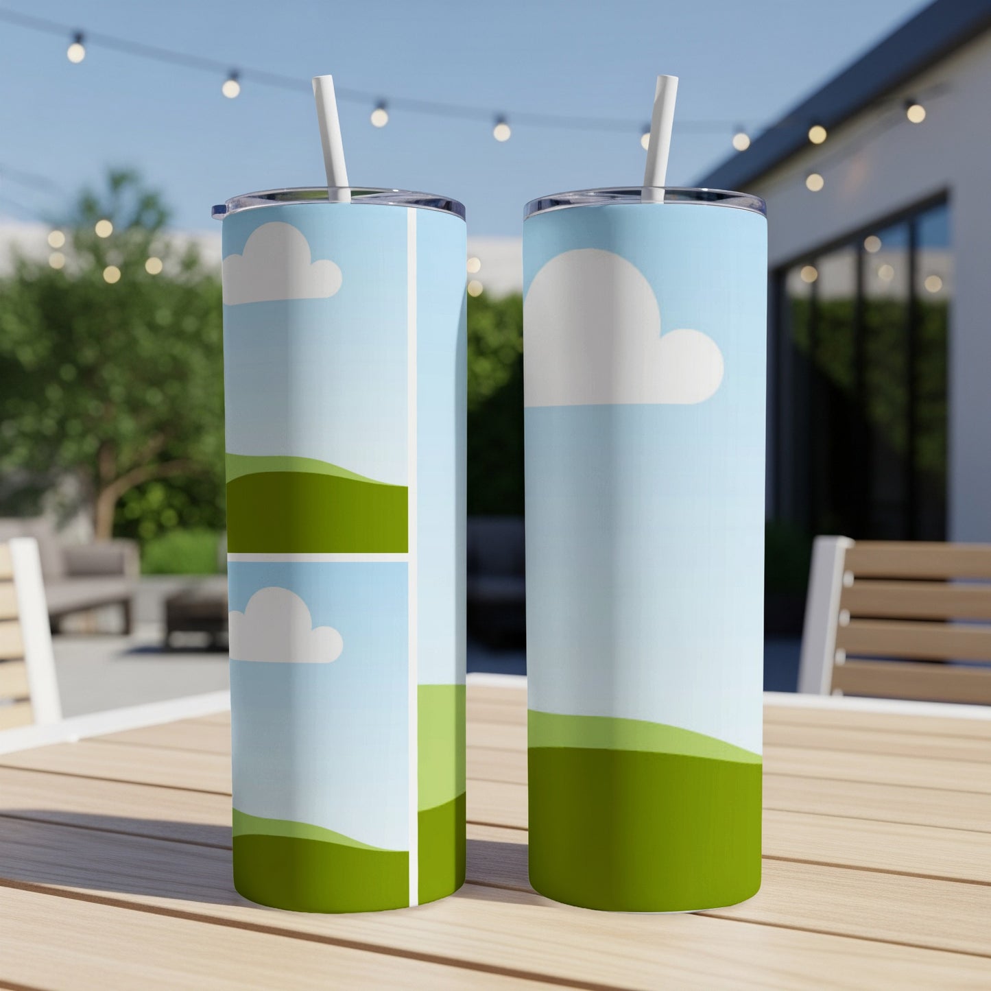 Two tumblers with a sky, cloud, and rolling green hill design.