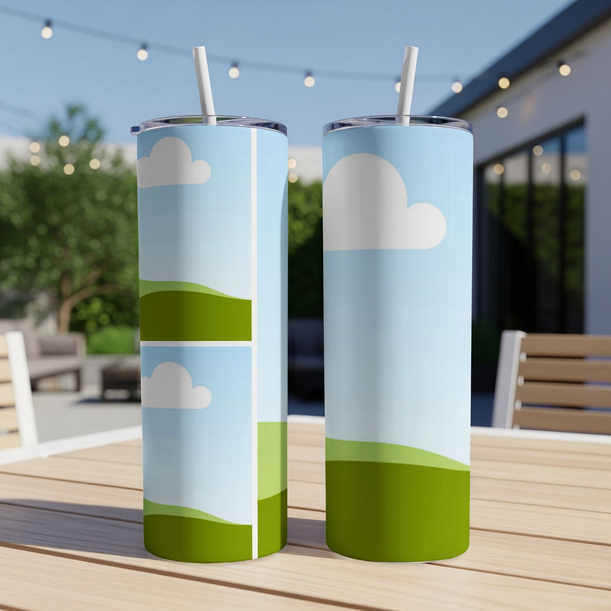 Two tumblers with a sky, cloud, and rolling green hill design.