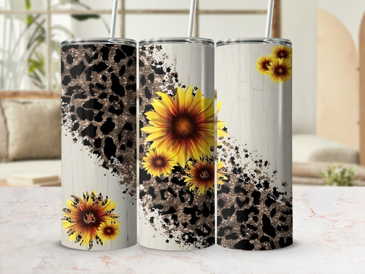 Three tumblers with leopard print and sunflower designs.
