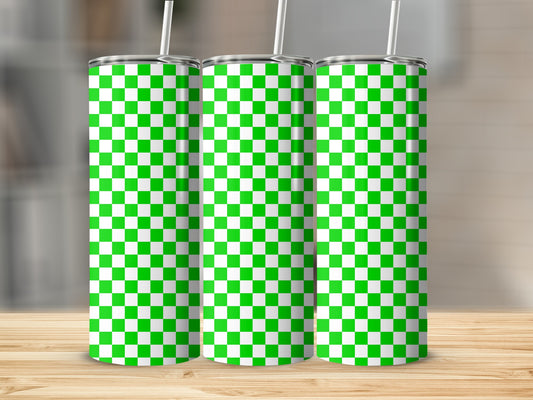Three green and white checkered tumblers with straws on a wooden surface.