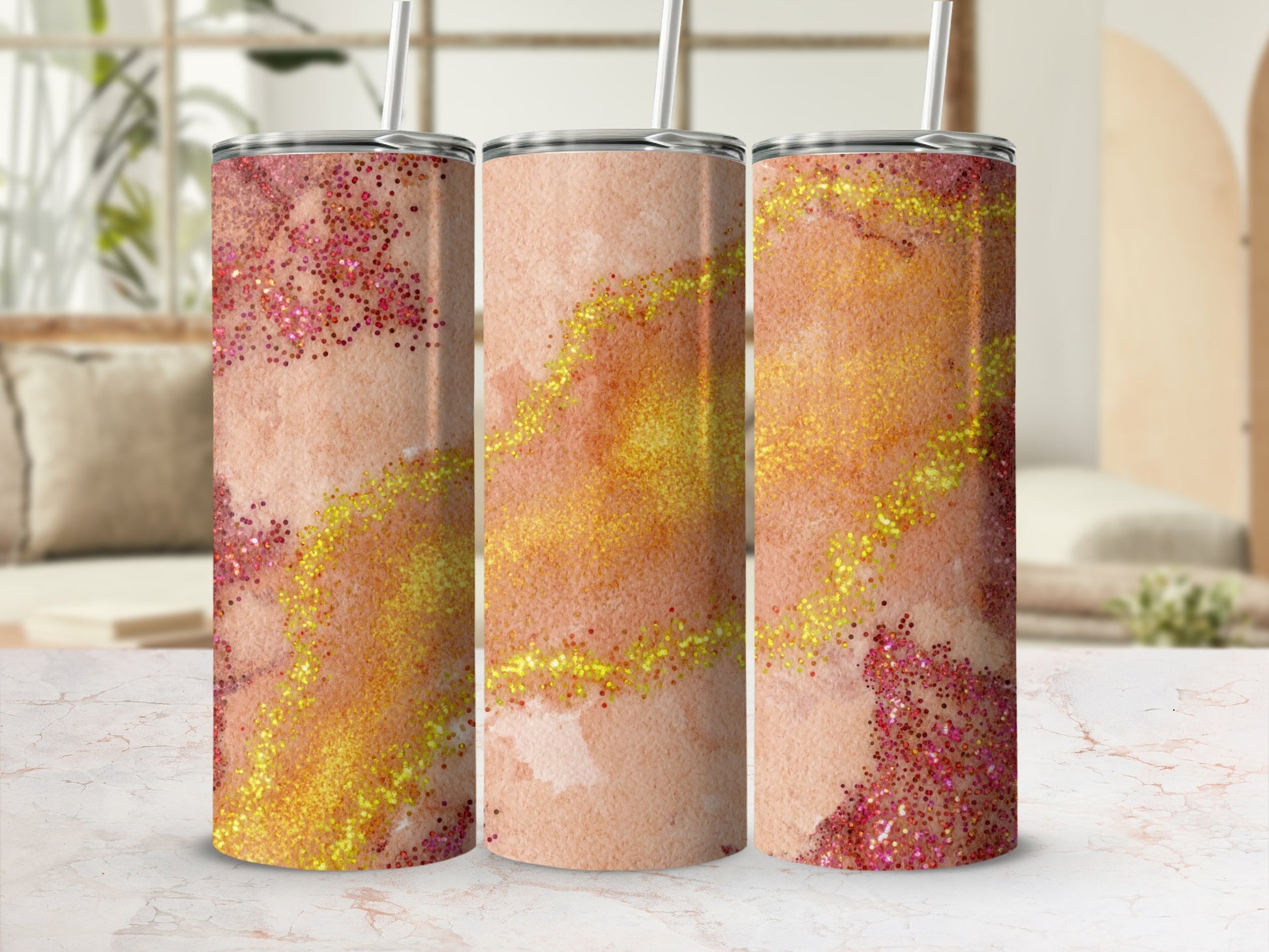 Three tumblers with a marbled, glittery pink and orange design.