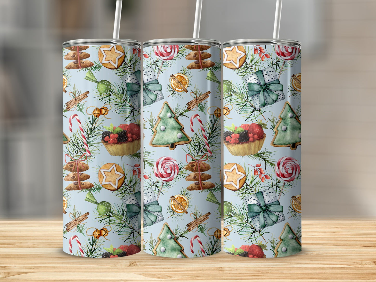 Christmas cookie pattern tumbler with straws on a wooden surface.