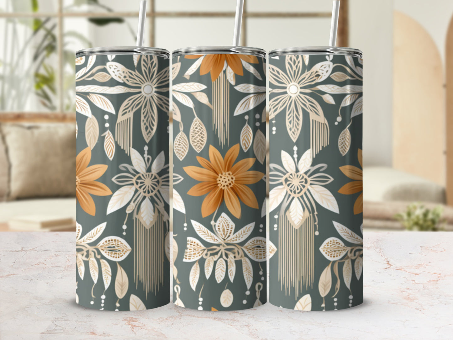 Three tumblers with floral and bohemian patterned design on display.