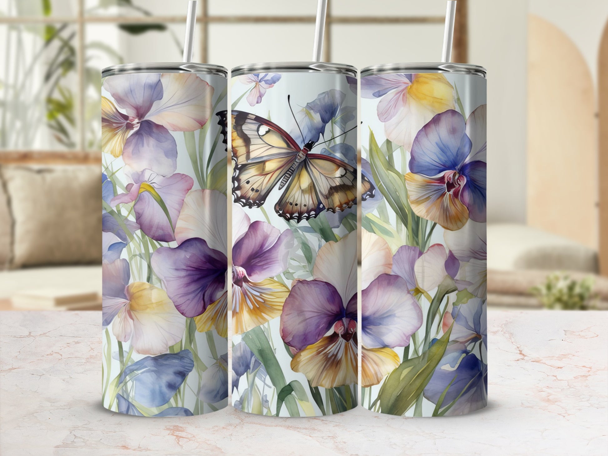 Three tumblers with a watercolor butterfly and floral design.